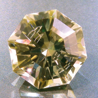 <span class="mw-page-title-main">Facet</span> Flat surface of a gem, crystal, etc.