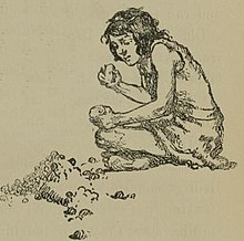 A boy making a stone tool