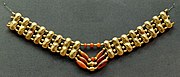 Necklace with gold beads and carnelian beads, Cypriot artwork with Mycenaean inspiration, c. 1400–1200 BC.[citation needed] From Enkomi. British Museum.