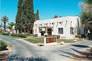 The Wigwam Organizational House, was originally built by The Goodyear Tire & Rubber Company in 1918, as lodging for local ranch suppliers. This was the first building of what was to become the Wigwam Hotel.[22]