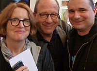 At the public opening reception of an art exhibit at a gallery in New York City, Saltz (center) is flanked by wife Roberta Smith and artist and Facebook friend Terry Ward.