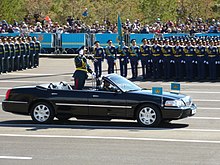 Major General Murat Bektanov, Commander in Chief of the Kazakh Ground Forces, commanding a military parade on Independence Square, Astana in a 2003 Lincoln Town Car Linkol'n-Kabriolet (1).jpg