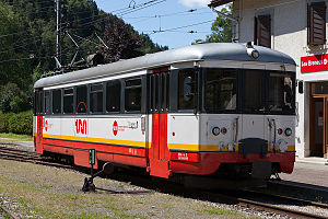 White-red railcar at station