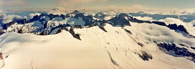 Photograph of an ice-capped mountain range covered in snow