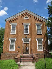 The main façade of a two-story brick building