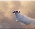 An air tanker releases water over the fire on July 22.