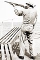 Image 74A merchant seaman aboard a fleet oil tanker practices target shooting with a Remington 870 12 gauge shotgun as part of training to repel pirates in the Strait of Malacca, 1984 (from Piracy)