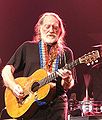 Willie Nelson and his guitar "Trigger" playing at Cardiff