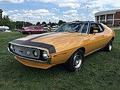 Shows a 1971 AMC Javelin AMX 401 in Mustard Yellow at 2015 AMO show