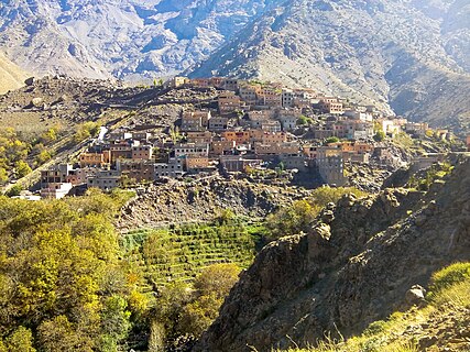 The picture is of a mountain village called Armed, located in the High Atlas Mountains in Morocco at an altitude of 1800 meters. The nearest city is Marrakesh. Its inhabitants are Berbers, its official language is Amazigh. Its inhabitants retain the ancient Amazigh traditions.