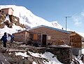 Old Tête Rousse Hut, now dismantled, with the new behind