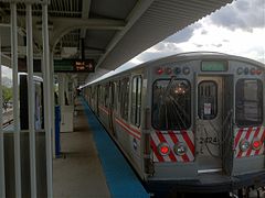 A Green Line train sits at the Harlem/Lake terminal