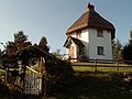 A pyramid roof with a chimney exiting the peak, The Round House, Finchingfield, Essex, England