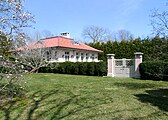 Garden gate and guest house at Hollyhock, Southampton, New York.