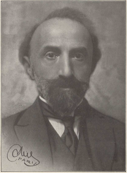 Portrait en noir et blanc d'un homme portant une barbe et une moustache.