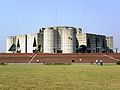 Image 62Jatiyo Sangsad Bhaban is the National Assembly Building of Bangladesh, located in the capital Dhaka. It was created by architect Louis I. Kahn and is one of the largest legislative complexes in the world. It houses all parliamentary activities of Bangladesh. Photo Credit: Karl Ernst Roehl