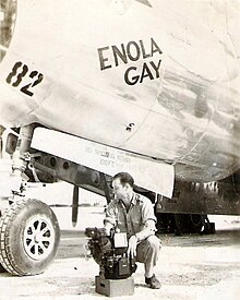 Enola Gay bombardier Thomas Ferebee with the Norden bombsight on Tinian after the dropping of Little Boy ThomasFerebee.jpg