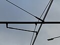 Overhead lines at Morden Road tram stop, Two 11.5mm wires electrified at 750v DC.