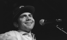 Steve Goodman in front of a microphone