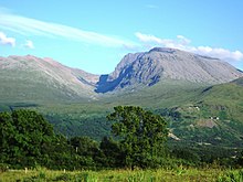 A view of Ben Nevis in the distance, fronted by rolling plains