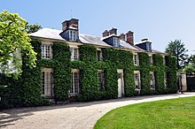 La Maison de Richard couverte de lierre.