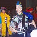 Costumed banjo player at New Orleans Carnival party