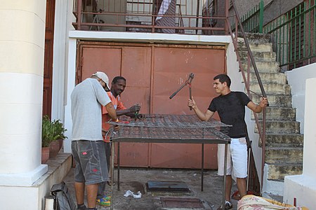 Repairing an all-metal boxspring in Cuba