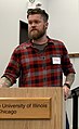 Image 22American man wearing a slim-fitting flannel shirt, a beard, and an undercut, 2019. Sleeve tattoos can be seen. (from 2010s in fashion)