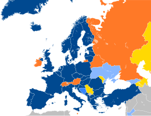 A map of Europe with countries in blue, cyan, orange, and yellow based on their NATO affiliation.