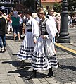 Transylvanian Saxon women in traditional costumes attempting a folk dance