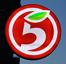 Logo of the store, a white number 5 where the top of the number is instead a green leave. The whole number is inside a white circle on top of an orange background.