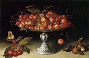 Cherries in a silver compote with crabapples on a stone ledge