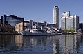 A French navy (Marine Nationale) ship heads towards the City Canal western lock in London's Canary Wharf.