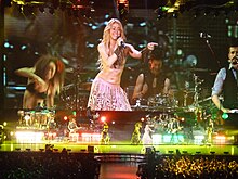 Shakira performing "Waka Waka (This Time for Africa)" during The Sun Comes Out World Tour in Madrid, Spain. The song peaked at number one in Spain for 17 consecutive weeks. Shakira-15.JPG