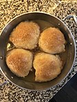 Baked apple dumplings in a pan.jpg