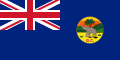 This is the SVG vector image of the flag and government ensign of the Colony of the Gold Coast from 1877 to 1957. It is recommended to create a new SVG vector image based on this SVG. Just change the background color from blue to the same red as the Union Flag in the upper left corner. In addition, the black edge around the round badge should be removed.