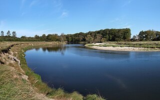 Slip-off slope Depositional landform on the inside convex bank of a meandering river