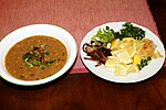 Pakistani Haleem served with garnish.jpg