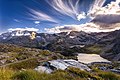 Le spectacle de la nature dans le parc national du Grand-Paradis. Dans le ciel on reconnaît des cirrus uncinus et des stratocumulus. Septembre 2017.