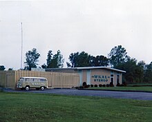 The combined WKAL studio and transmitter facility, South Jay Street,Rome, NY; Spring of 1974. During the previous year, FM Stereo service had been initiated, simulcasting AM programming. The station's building markings were updated to advertise the change. To the left the station's VW Bus can be seen which was utilized during this period for promotional events.