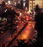 A city street in Mumbai, India with left-hand traffic Roadmumbaiindia.jpg