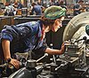 Detail from Ruby Loftus Screwing a Breech Ring, a 1943 painting by British painter Laura Knight