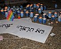 Yahrzeit candles and signs entitled "You shall not murder" at a solidarity rally at Rabin Square for the victims of the 2009 Tel Aviv gay centre shooting