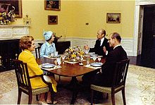 First Lady Betty Ford, with President Gerald Ford, Queen Elizabeth II, and Prince Philip in the President's Dining Room in conjunction with a 1976 state visit during the US Bicentennial BettyFordNARA.jpg