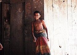 A boy in a village of Narail, Bangladesh wearing a lungi with simple twist knot LungiBoypagne.jpg