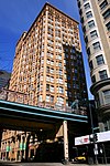 The Chicago 'L' is sandwiched between the Fisher Building and the Old Colony Building