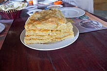 Feteer meshaltet, a pastry often eaten as a dessert by dipping in honey and eshta or with various sweet fillings. Egyptian-food-13.jpg