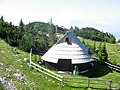 Curved roof construction is traditional for the huts on Velika Planina