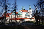 Church with white walls, red roof and copper-covered domes