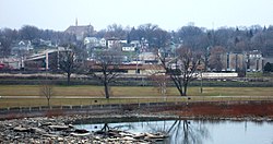 Kaukauna's south side downtown, as seen from the Statue Park on the North Side. The Fox River is in the foreground and the Civic Center is on the far right.